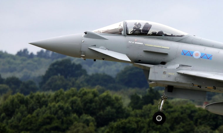 Image: Typhoon jet performs a display flight at the Farnborough Airshow 2012 in southern England